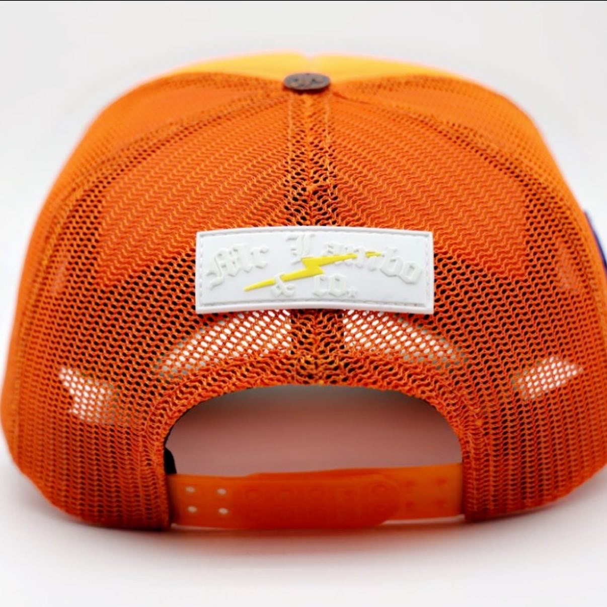 Orange and green trucker