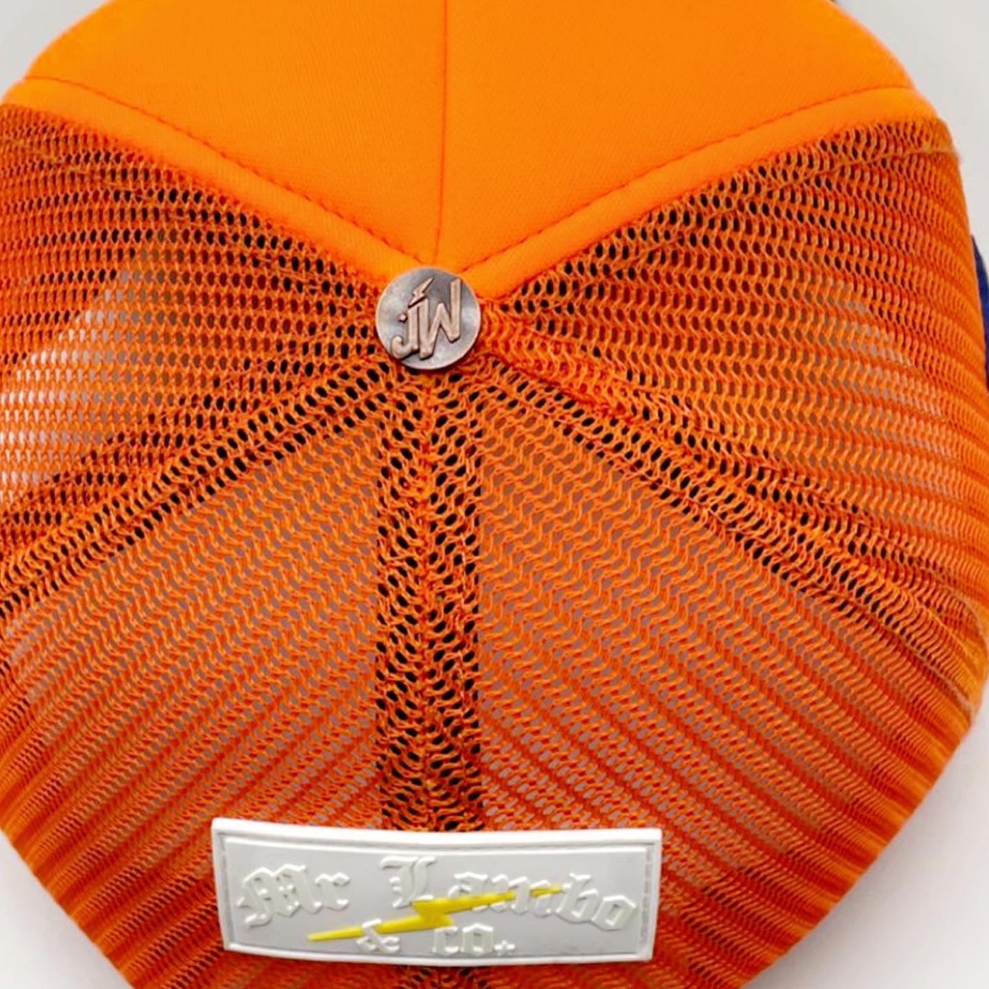 Orange and green trucker